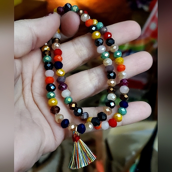 Crystal rondelle beaded stretch bracelet with tassel charm. 6mm beads. - Picture 3 of 4